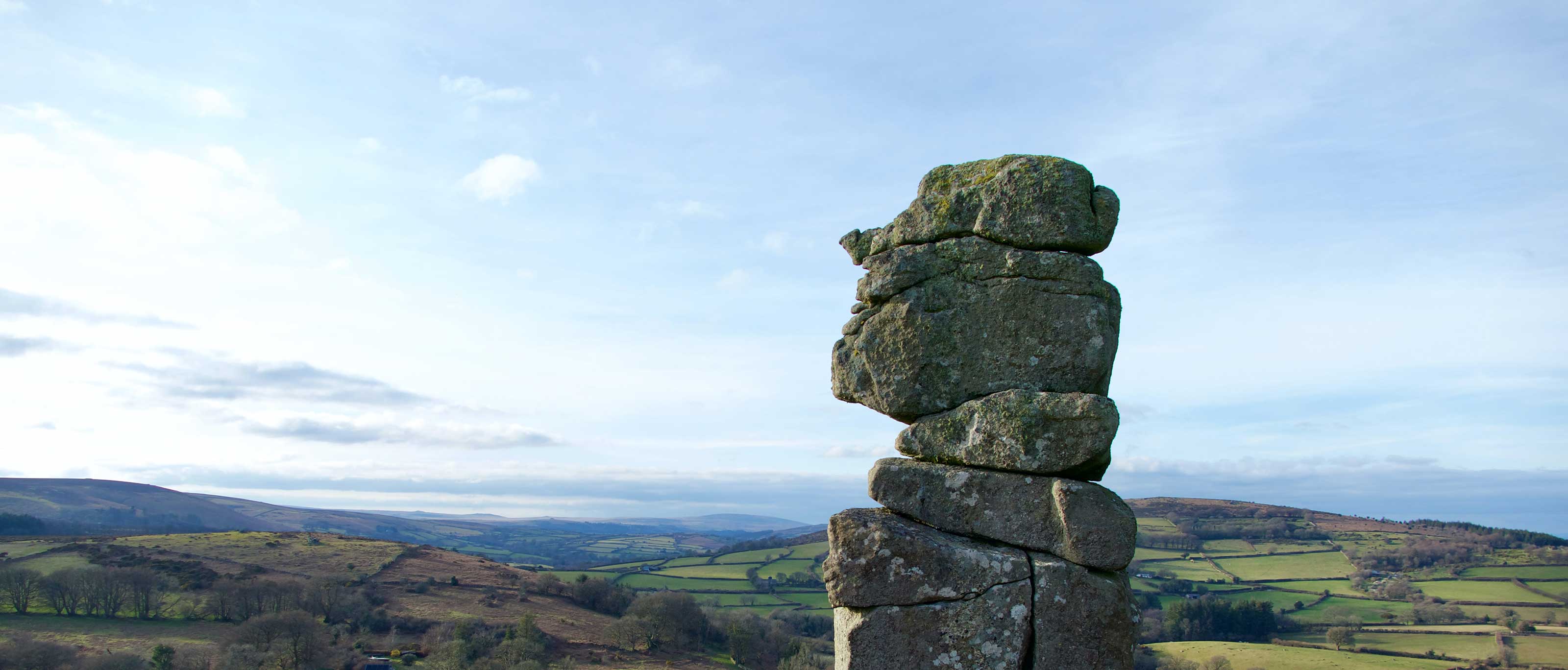 The granite pinnacle of Bowerman’s Nose, a well-known Dartmoor landmark. Photo by Terry Montague on Unsplash